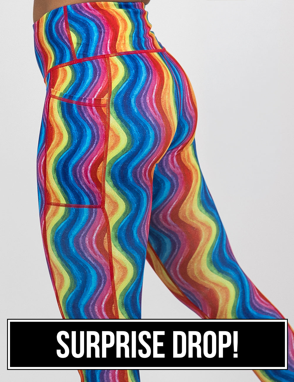 rainbow waves leggings facing the side against a white background, surprise drop