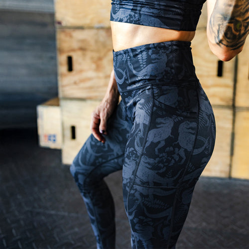 model wearing dinosaur leggings in the gym