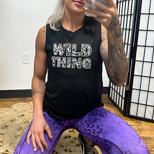 model wearing a black muscle tank with the design "wild thing" on the front.