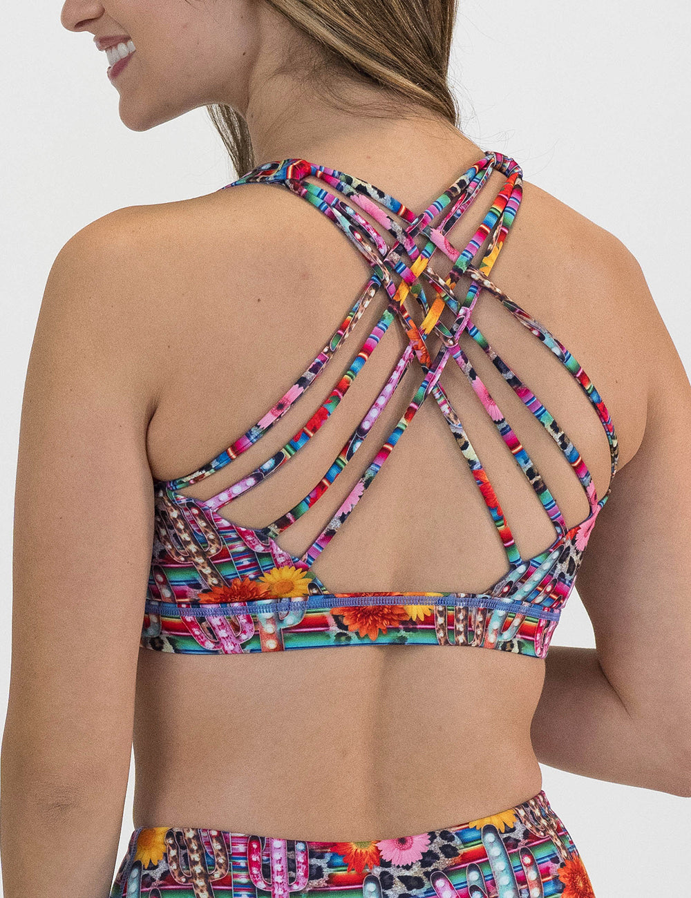 back of the colorful cactus and flower print sports bra