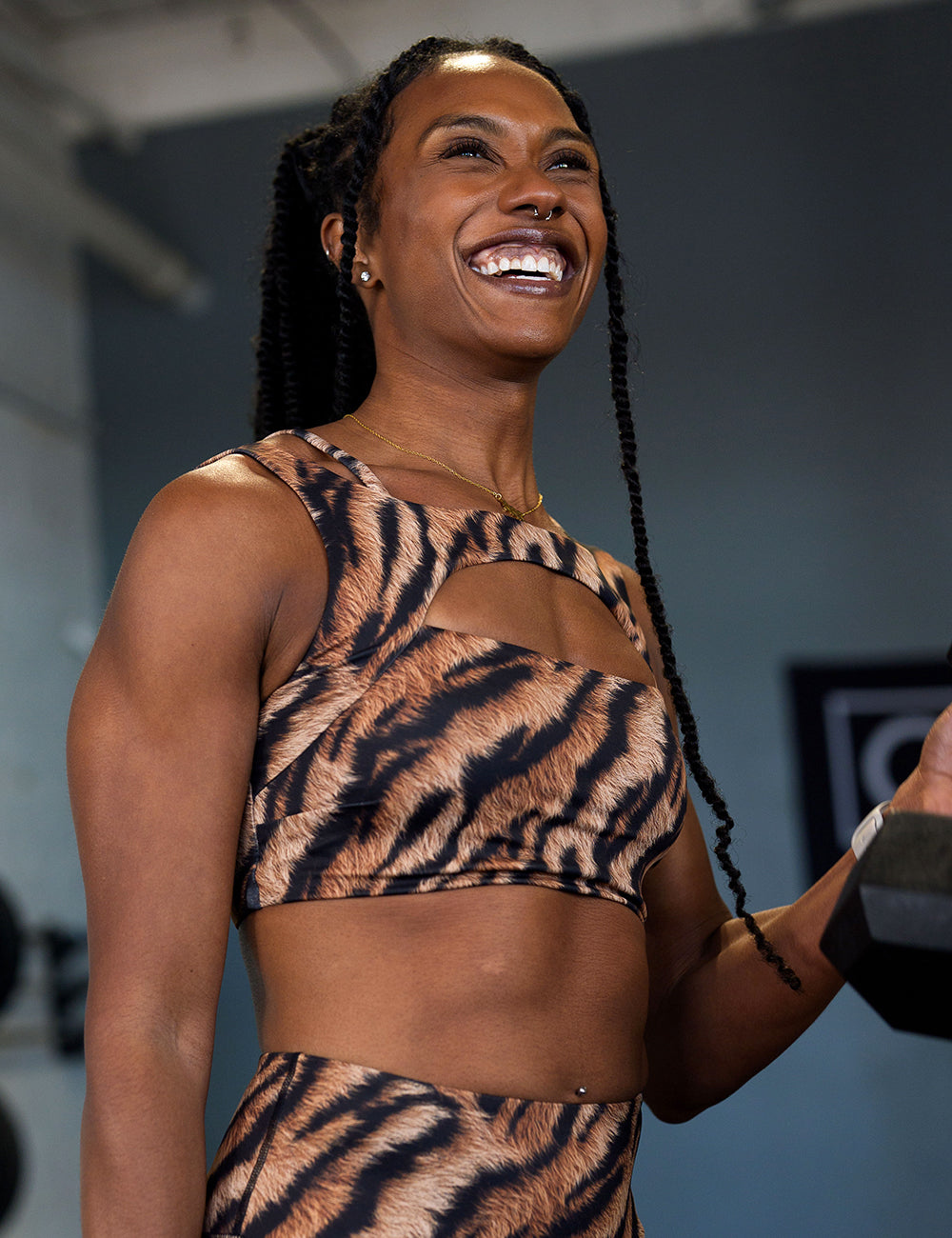 model wearing the tiger print vista bra in the gym working out
