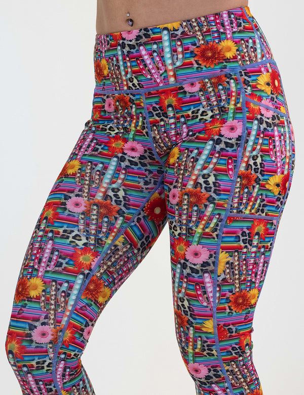 colorful cactus and flower print leggings against a white background