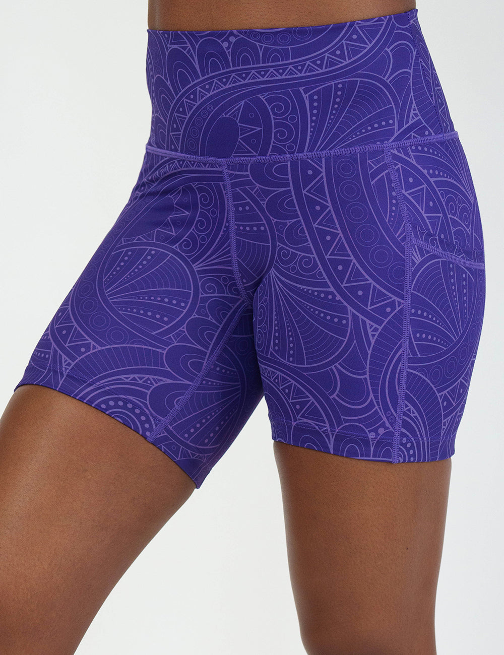 front of the 5 inch purple with a white swirl pattern shorts against a white background