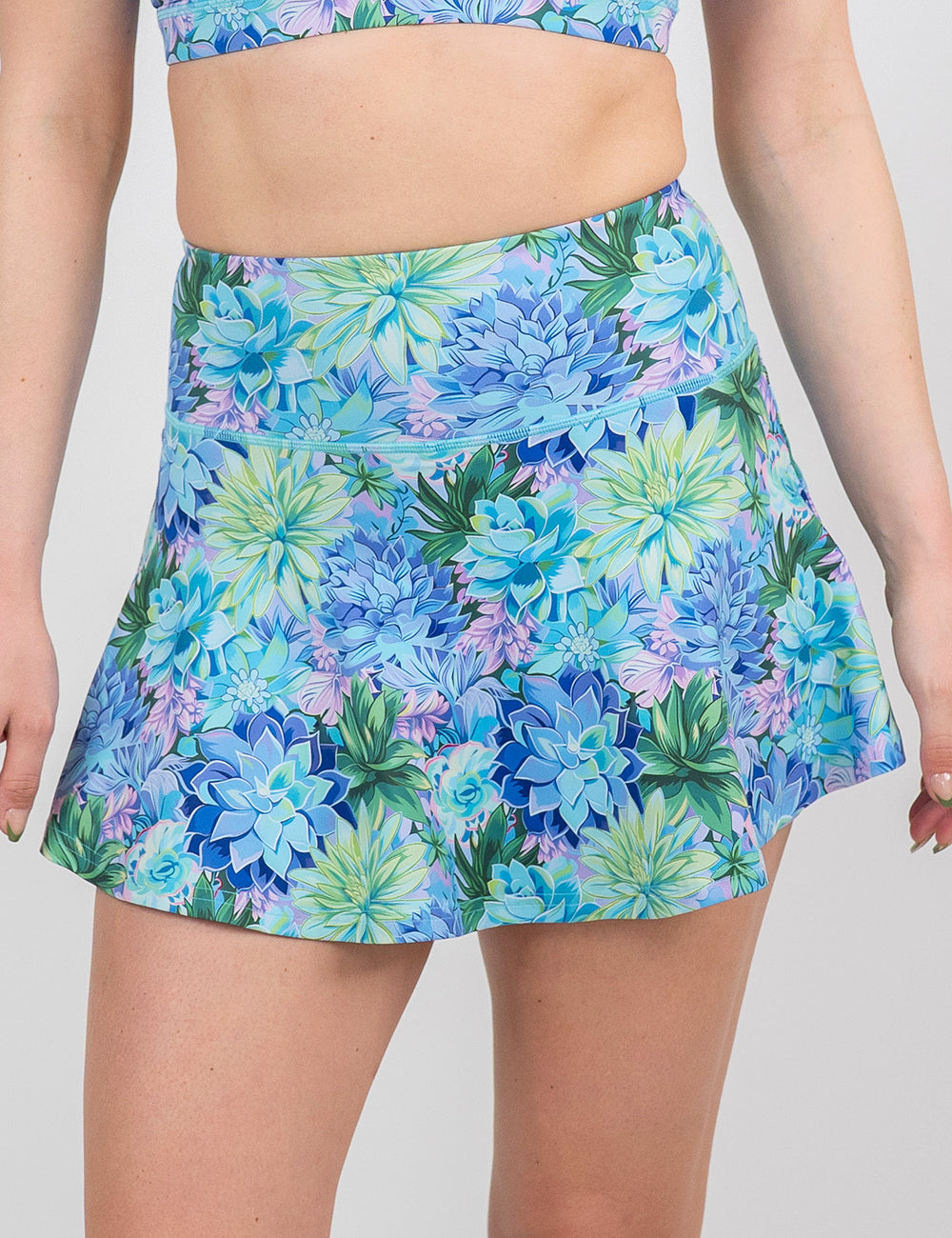 front of the regular length blue flowers skirt against a white background