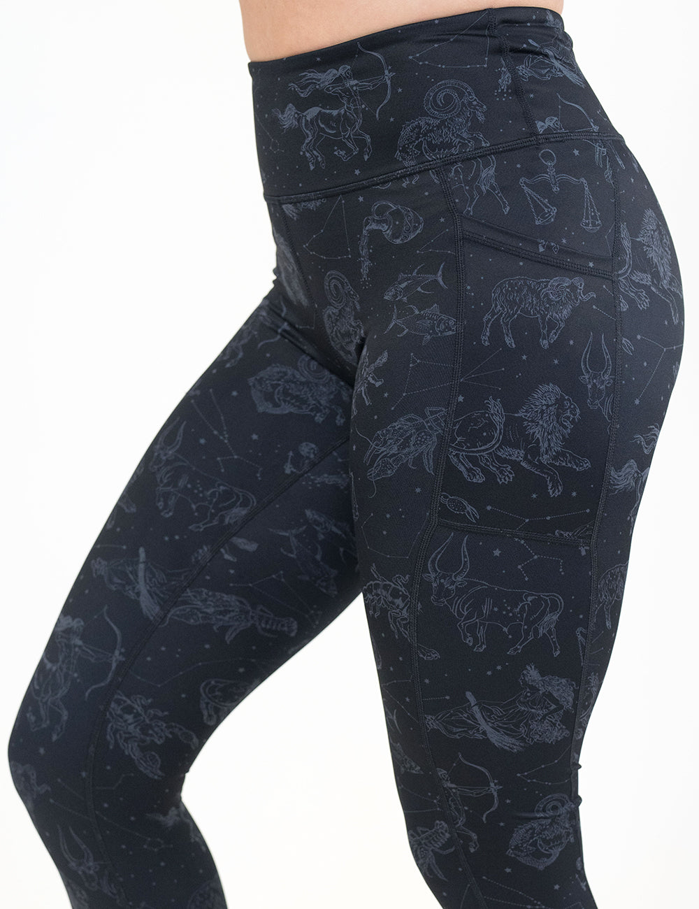 front of the black leggings with constellations on them against a white background