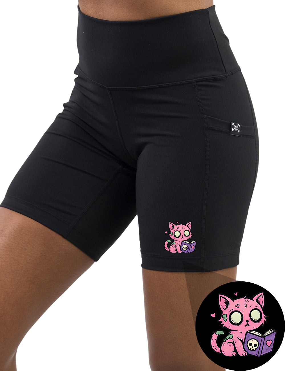 front of the pink zombie cat reading a book graphic 7 inch shorts