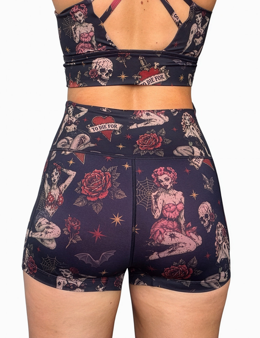 back of the 2.5 inch zombie girls with pin up hair and traditional tattoo designs shorts against a white background