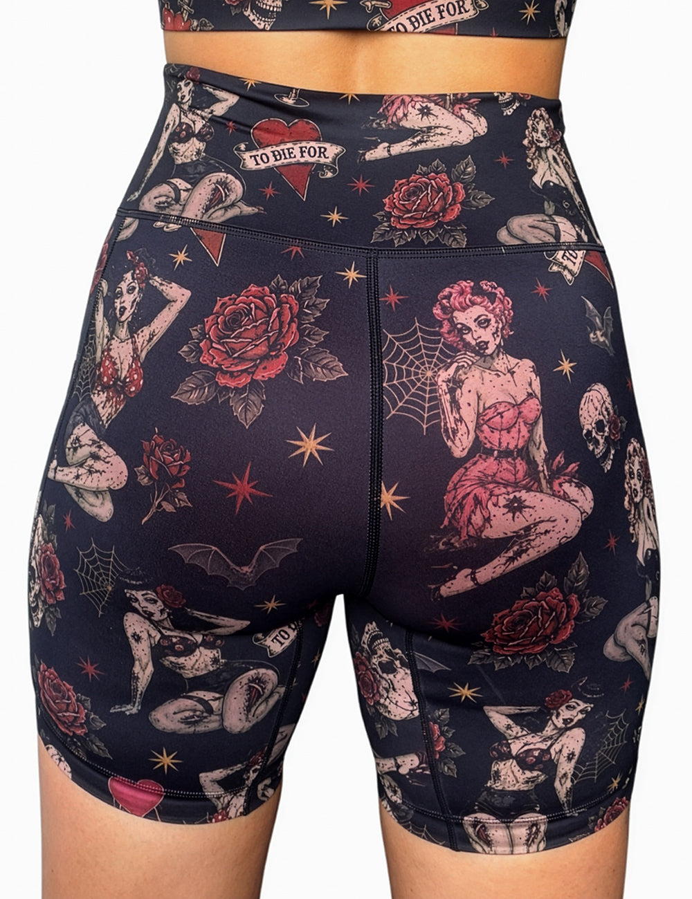 back of the 7 inch zombie girls with pin up hair and traditional tattoo designs shorts against a white background