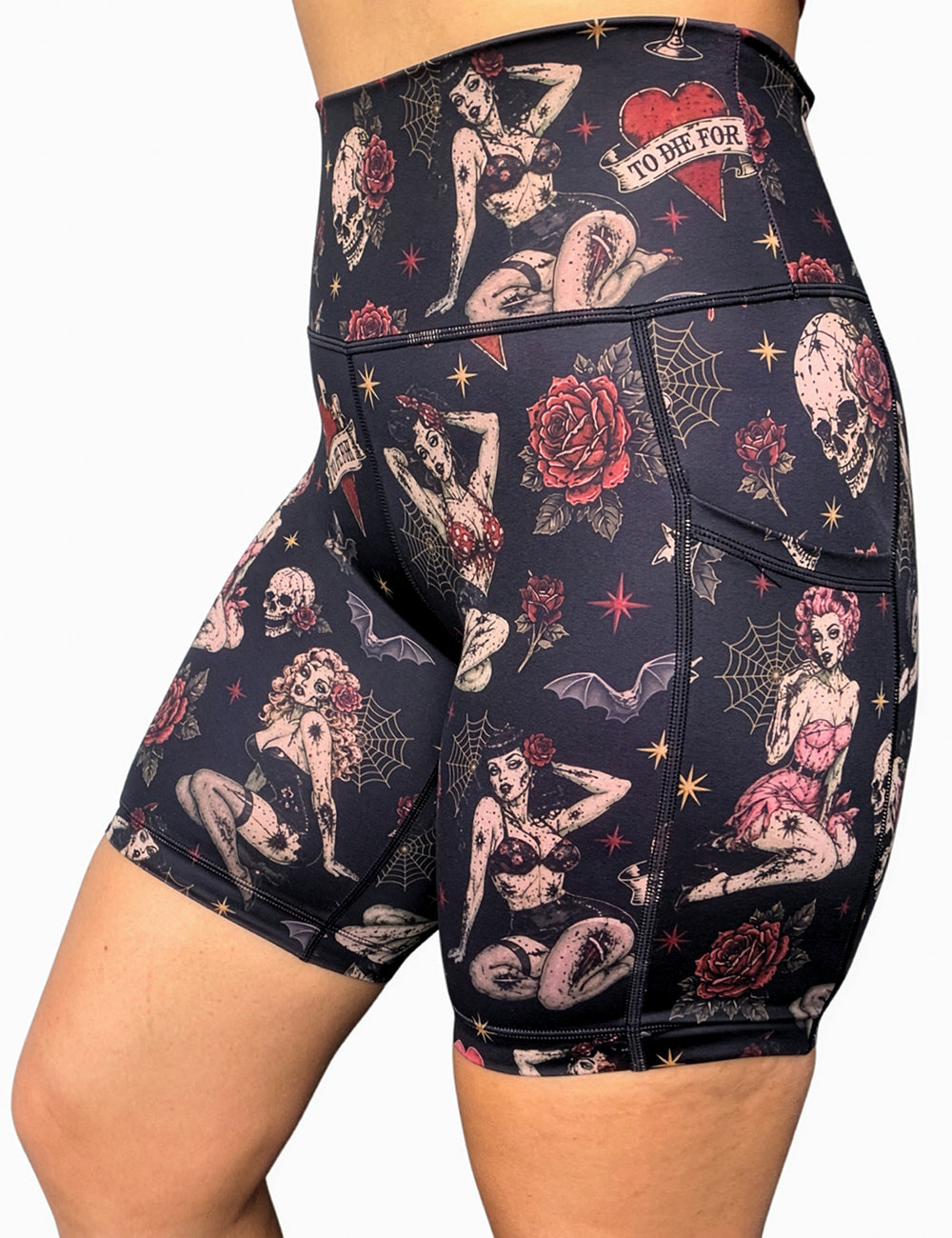 front of the 7 inch zombie girls with pin up hair and traditional tattoo designs shorts against a white background