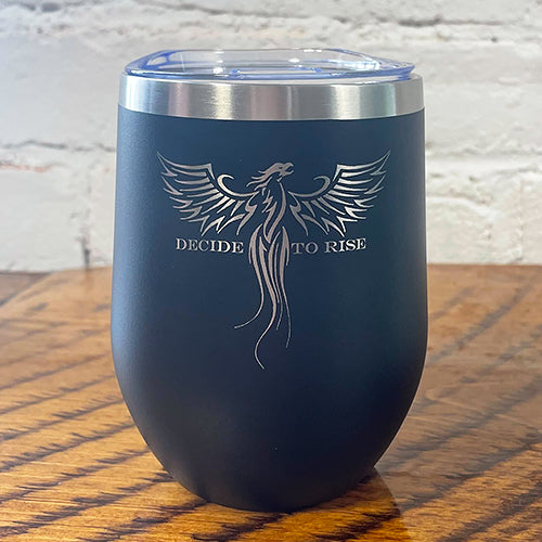 12oz black tumbler with silver phoenix bird in the top center with the saying "decide to rise" behind it