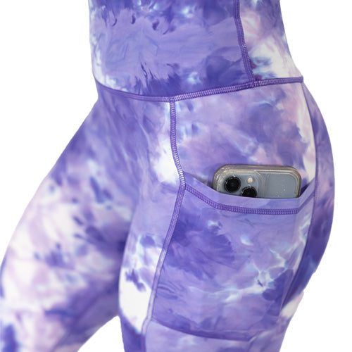 side pocket view of purple colored tie dye leggings