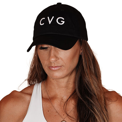 Photo of a model wearing a black snapback hat that has the CVG logo on the front