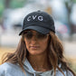 Photo of a model wearing a black snapback hat that has the CVG logo on the front
