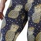 close up of black leggings with gold pineapple pattern