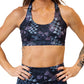 front view of abstract skull print sports bra