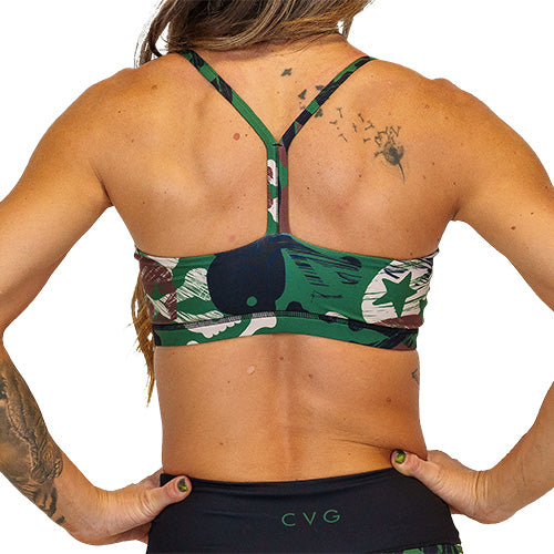 back view of criss cross strap design on green, black, brown and tan camo skull patterned bra