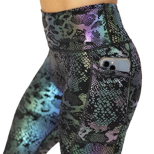pocket view of black, purple and green holographic leggings