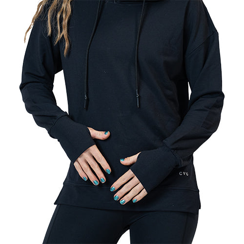 Photo of a model wearing a black hoodie, showing a close view of the sleeve thumbholes