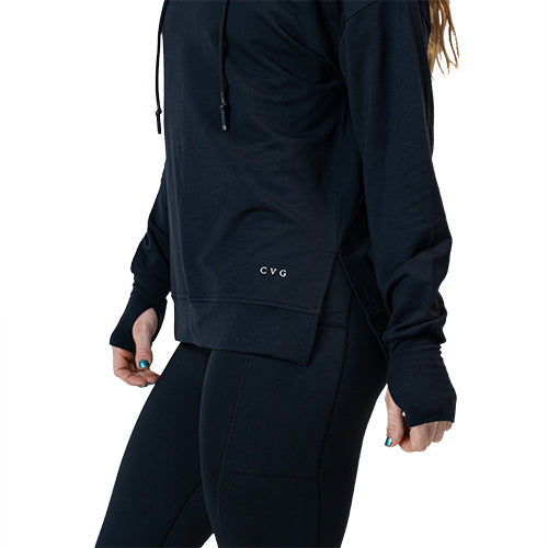Photo of a model wearing a black hoodie with the CVG logo on the bottom left corners