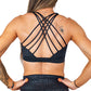 back view of black on black leopard print sports bra with butterfly back strap design