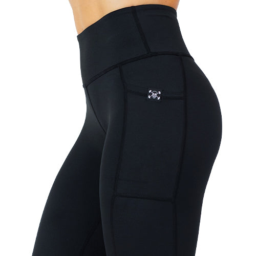close up of solid black leggings with mini skull and barbells logo on side pocket