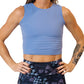 Close up photo of a model wearing a blue fitted crop top