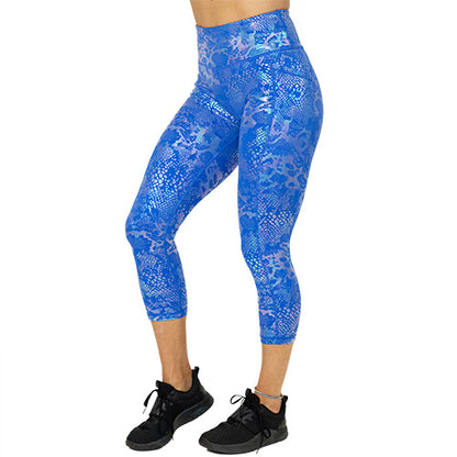 side view of blue and purple holographic capri leggings