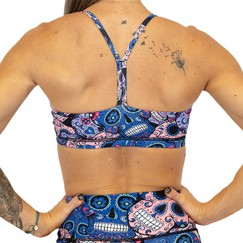 back view of the cotton candy skulls sports bra