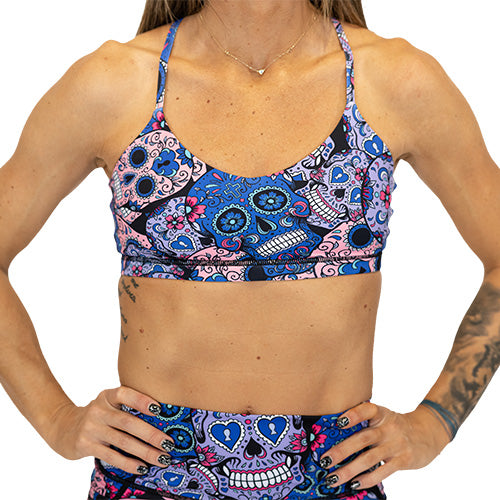 front view of the cotton candy skulls sports bra