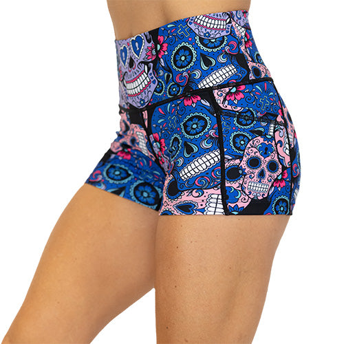 side view of blue, pink and teal sugar skull pattern on 2.5" shorts