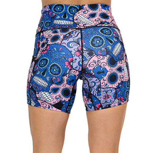 back view of blue, pink and teal sugar skull pattern on 5" shorts