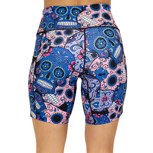 back view of blue, pink and teal sugar skull pattern on 7" shorts