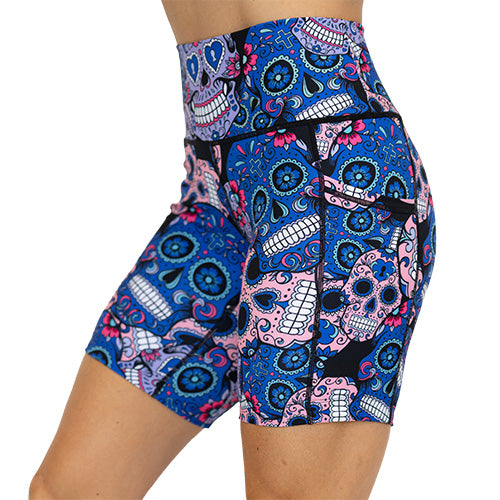 side view of blue, pink and teal sugar skull pattern on 7" shorts