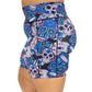 side pocket view of blue, pink and teal sugar skull pattern on 7" shorts