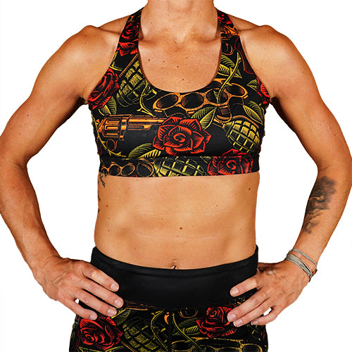 front view of rose and gun patterned sports bra