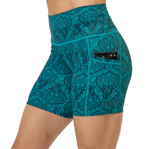 5 inch blue elephant outline shorts facing the side with a phone in its pockets against a white background