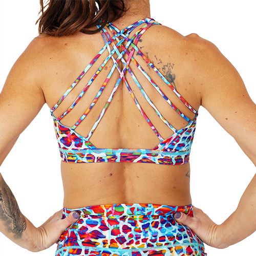 back view of the rainbow giraffe print sports bra