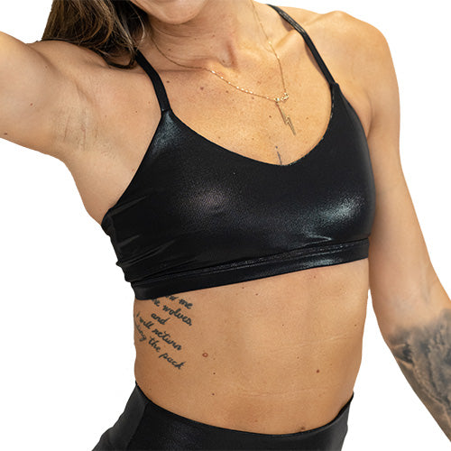 front of black faux leather bra