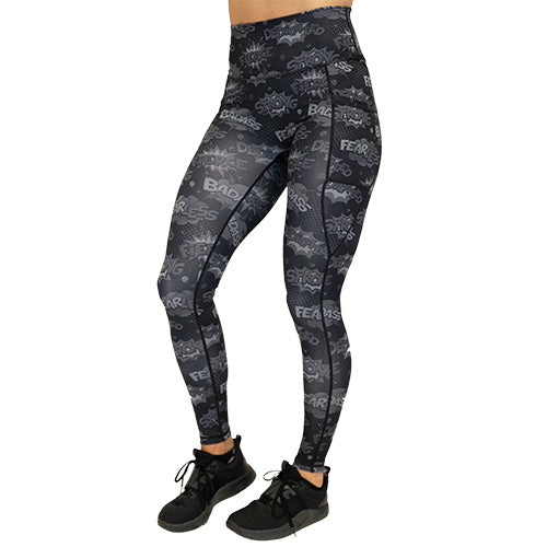 front view of full length black leggings with comic book style action bubbles that say "badass", "fierce" and "dedication"