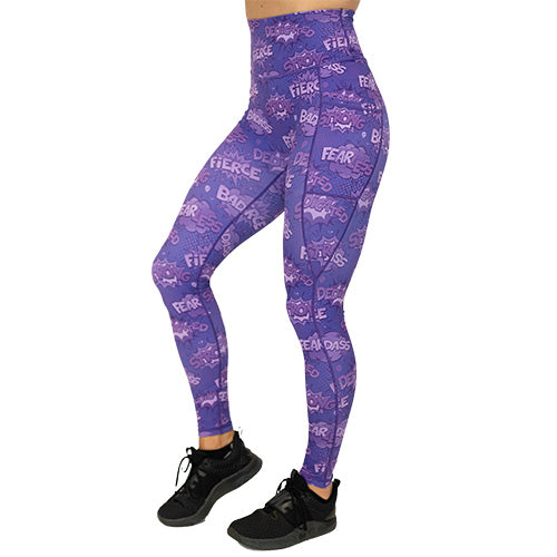 front view of full length purple leggings with comic book style action bubbles that say "badass", "fierce" and "dedication"