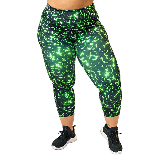 front view of capri length lime green and black dot print leggings