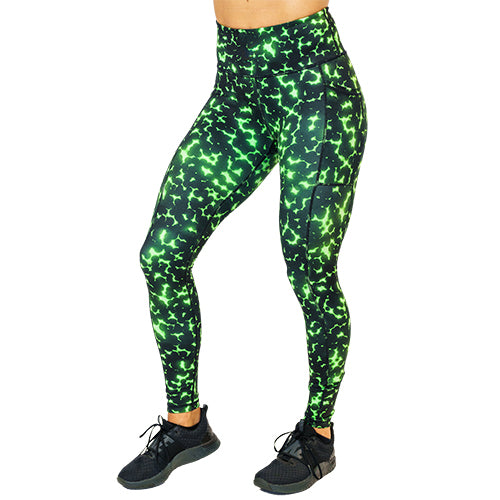 front view of full length lime green and black dot print leggings