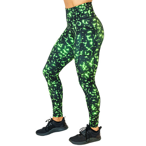 side view of full length lime green and black dot print leggings