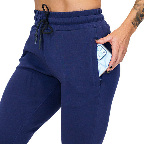 Close up photo of navy joggers showing a phone fitting into the pocket
