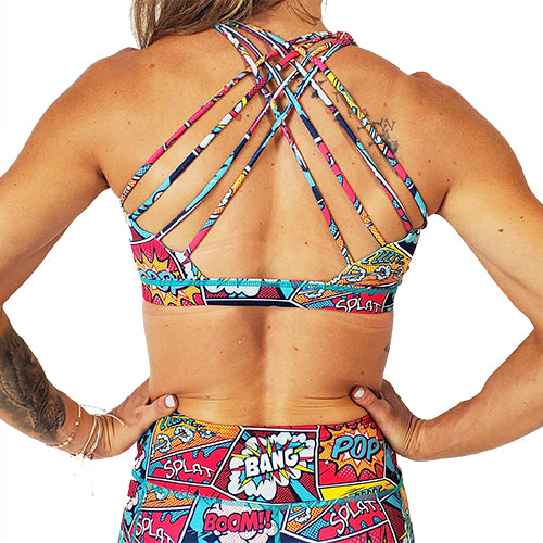 back view of butterfly strap design on comic book inspired print sports bra 