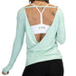 back view of the open back detailing on this mint green long sleeve shirt