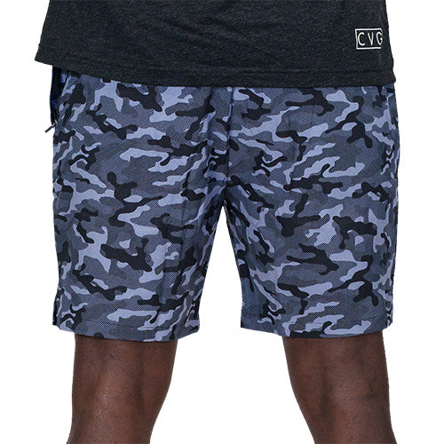 back view of black and grey camo quarter length unisex shorts