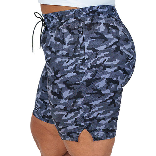side view of black and grey camo quarter length unisex shorts