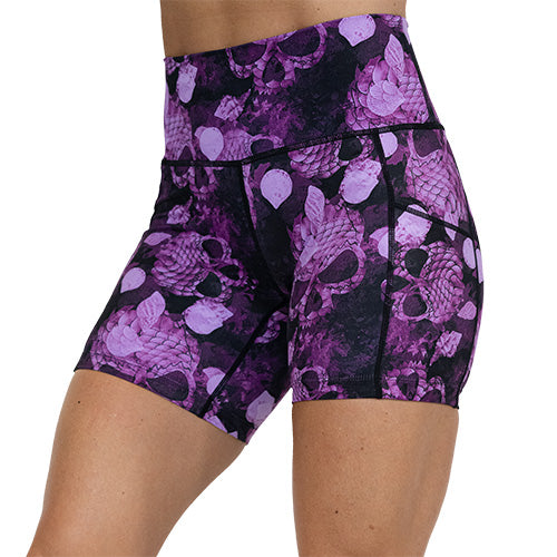 front view of 2.5 inch berry colored mermaid skull patterned shorts