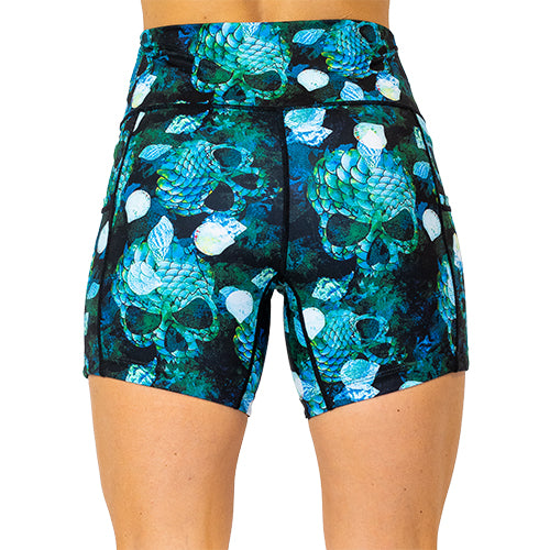 back view of 5 inch green colored mermaid skull patterned shorts